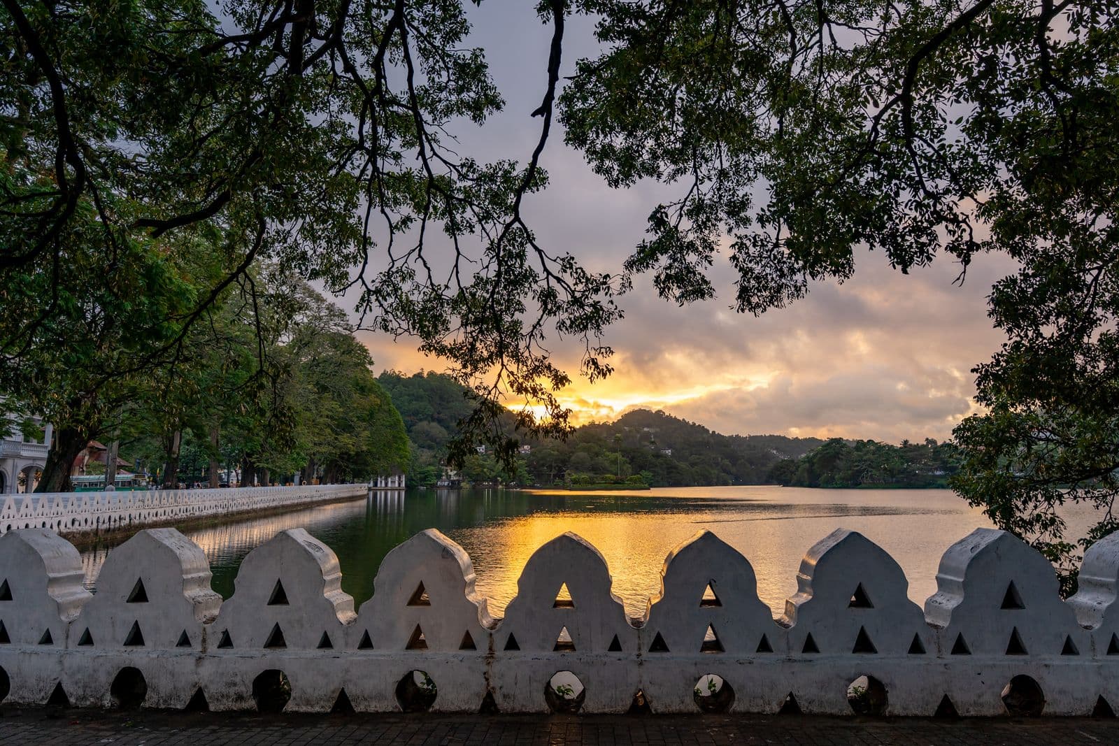 Sunset over Kandy Lake and its scalloped cloud wall, Sri Lanka